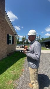 Michael talking about the importance of turning off electric meters at a house demo in Aiken